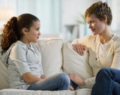 mom talking to a kid on couch