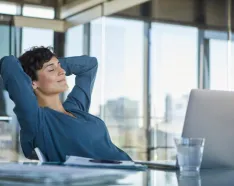 person meditating at desk