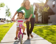 kid learning to ride a bike
