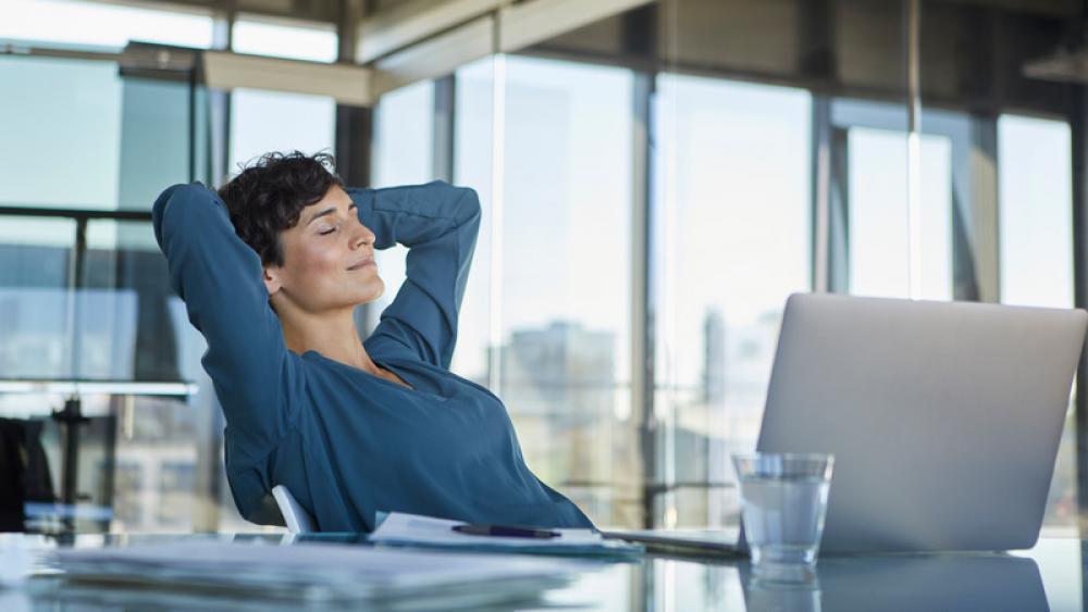 person meditating at desk