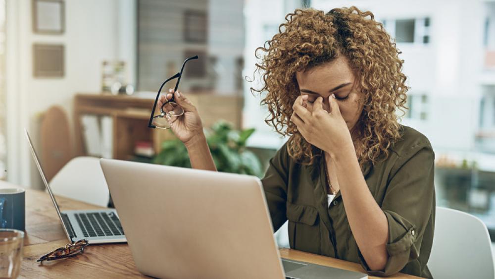 lady at computer with glasses off